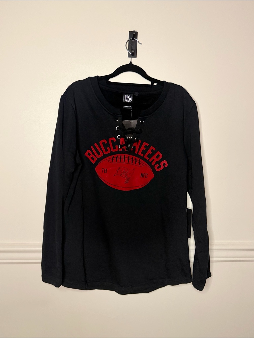 NFL Buccaneers Black Long Sleeve Lace-Up Tee with Red Graphic